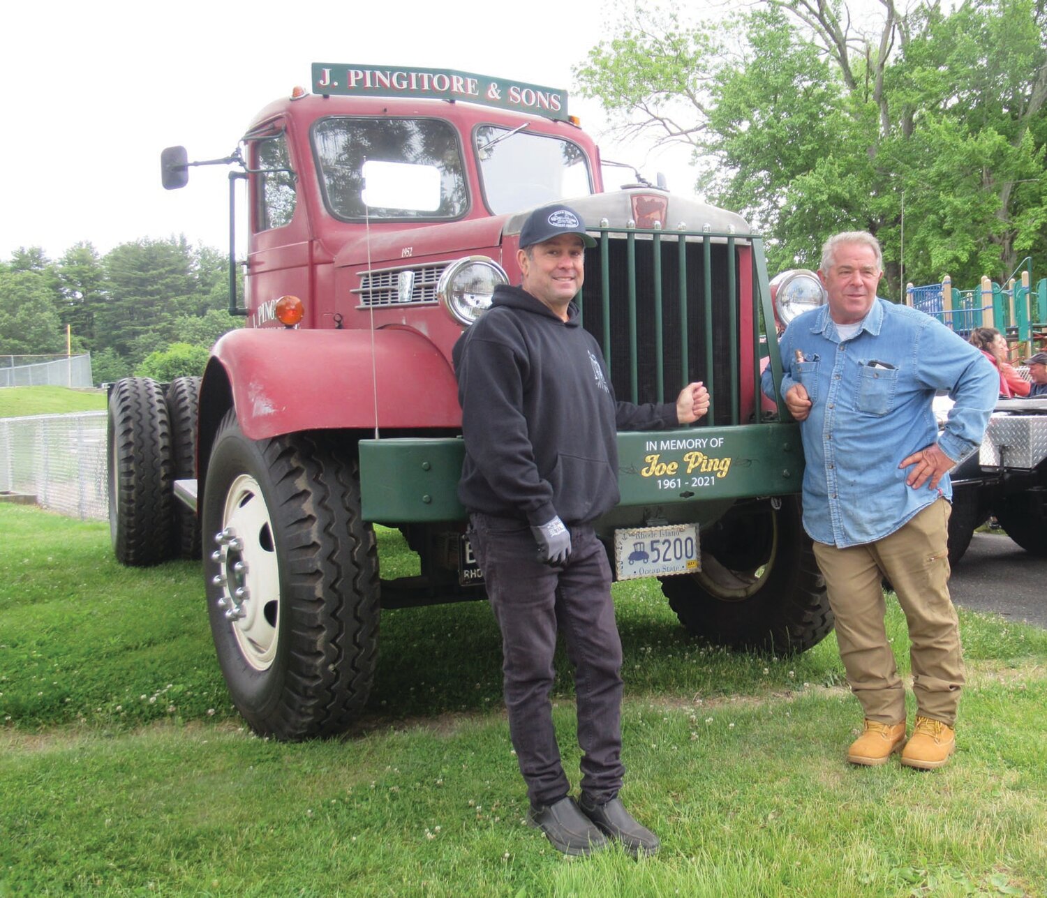 LINKED LEADERS: Ocean State Vintage Haulers Vice President Dave Pingitore (left) and President Ron Rossi stand in front of this 1952 Serling which was owned by the late Joe Pingistore, who for years served as the non-profit’s president.